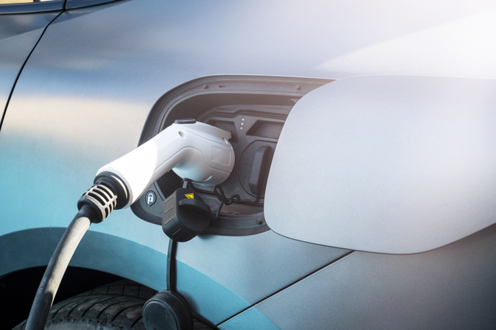 charging an electric car, close up.